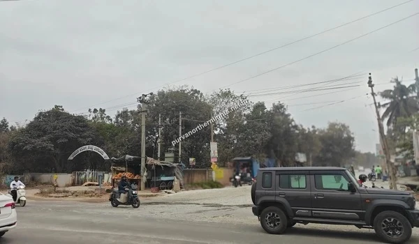View of a main road intersection and local landmark near Purva Northern Lights residential project