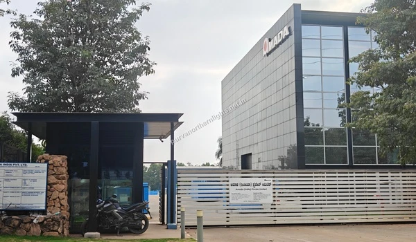 Main entrance gate and security cabin of the Amada India Private Limited campus located in the aerospace park close to the Purva Northern Lights residential project