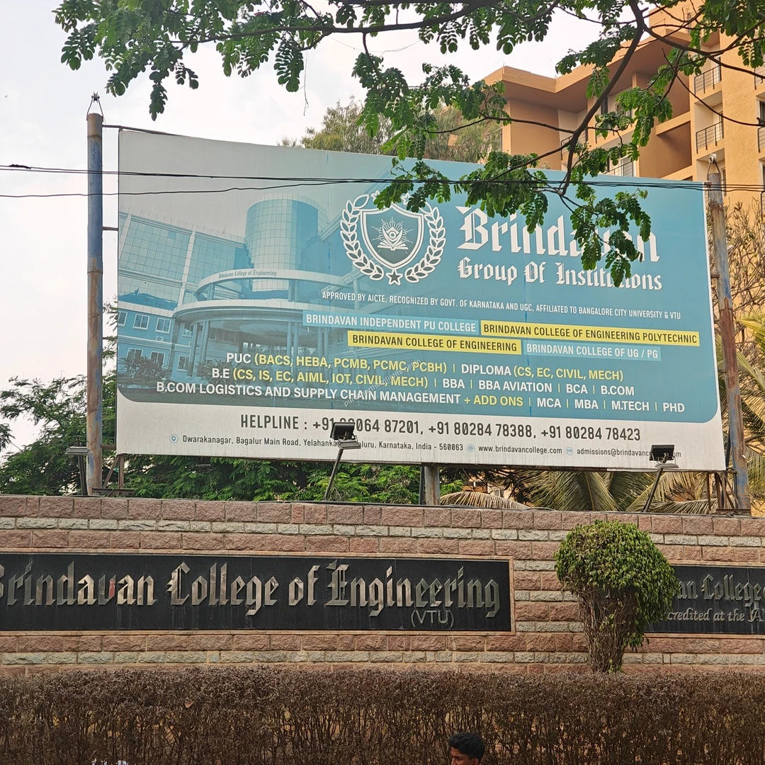 Brindavan Campus Sign The expansive Brindavan College of Engineering signage framed by green tree branches, offering higher education options close to the project.