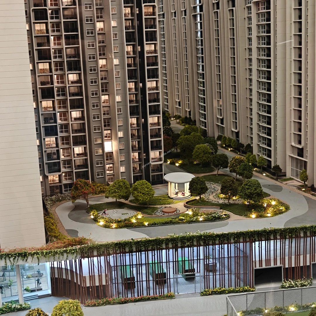 Top-down view of the miniature model featuring a central circular garden layout and relaxing gazebo at Purva Northern Lights