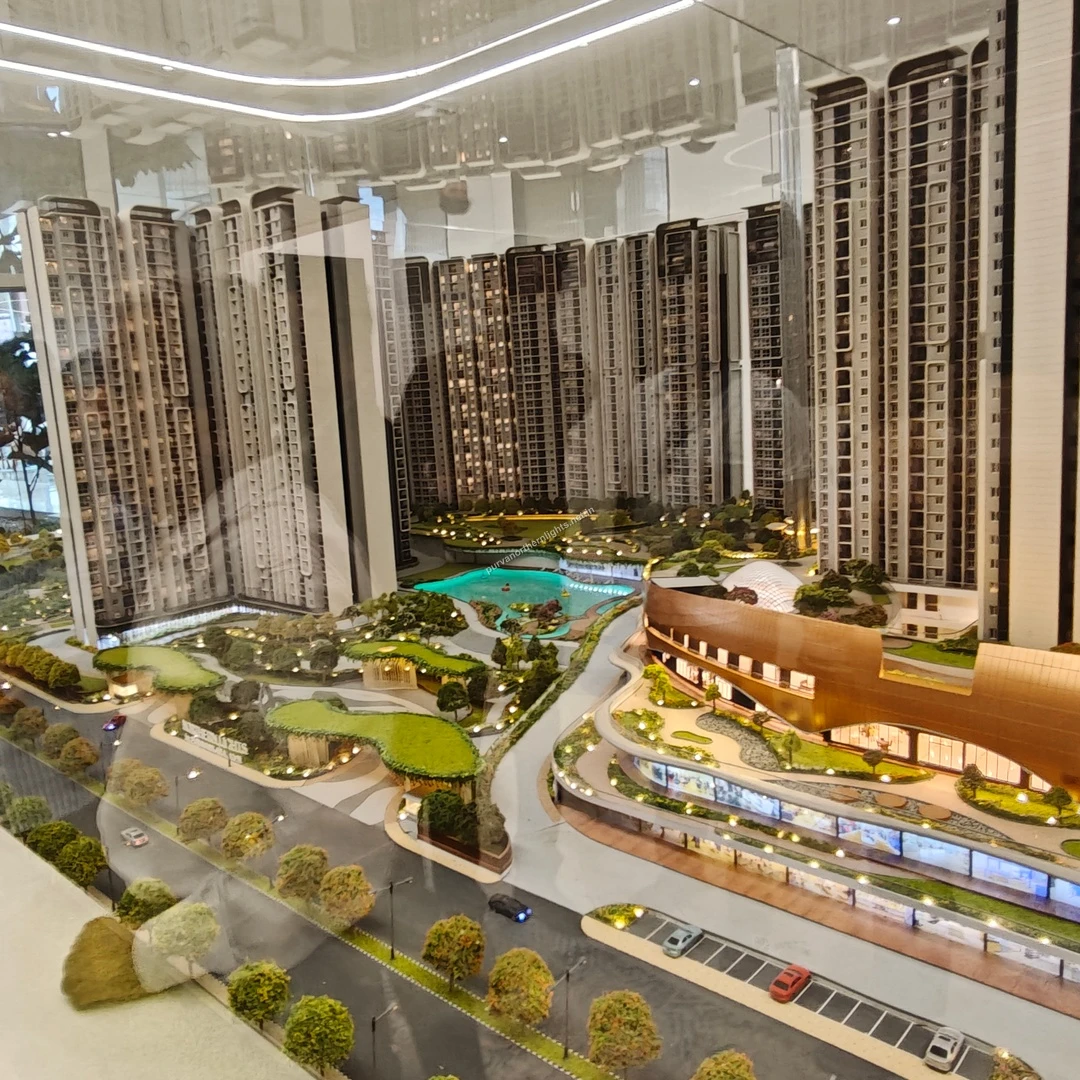 Comprehensive miniature view capturing the winding central pathways, the large pool basin, and the full extent of the clubhouse structure taken on mar 13