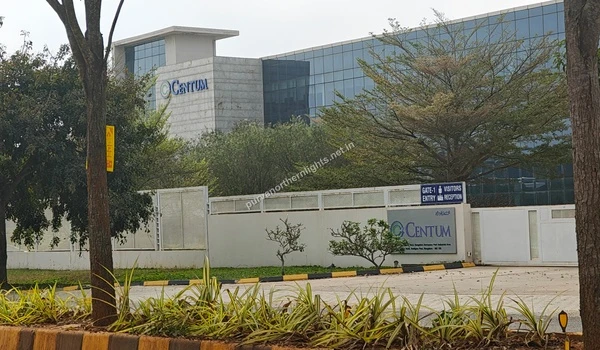 The landscaped entrance and modern glass exterior of the Centum facility providing excellent connectivity for residents of Purva Northern Lights