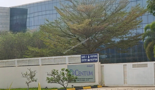 Close-up of the Gate 1 visitor entry and reception signage at the Centum facility located in the vicinity of Purva Northern Lights