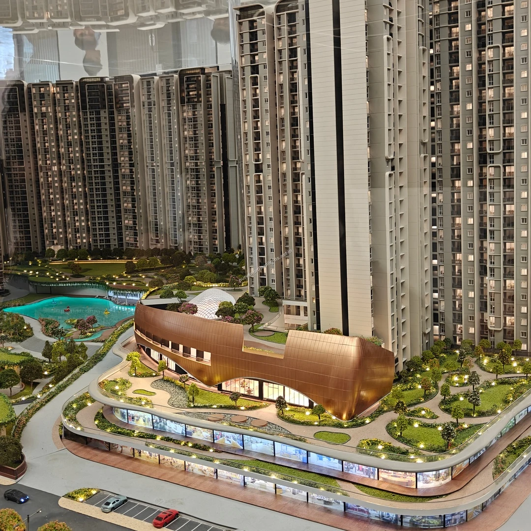 Striking miniature model perspective showcasing the copper-toned clubhouse and multi-level retail spaces observed on mar 13