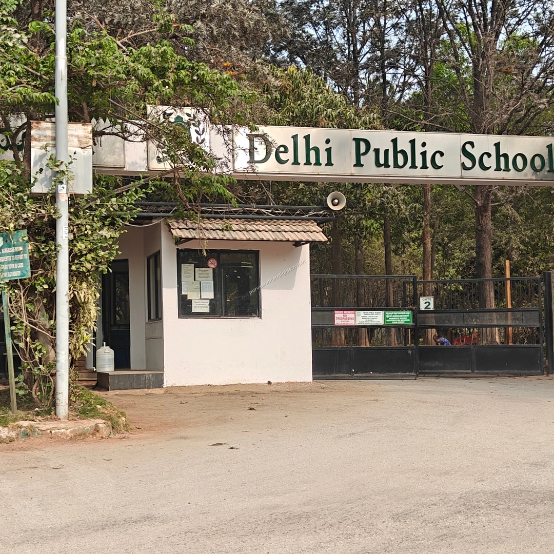 Delhi Public School The secure front gate and security cabin of Delhi Public School nestled among green trees, captured this Mar 13.