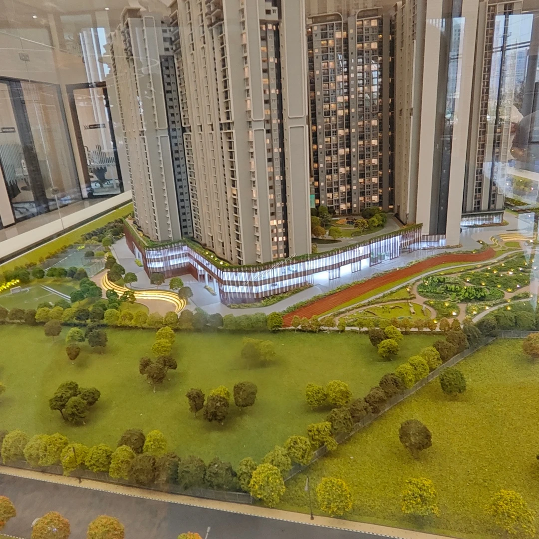 Elevated scale model perspective showcasing the designated walking track and beautifully terraced landscaping next to the residential blocks