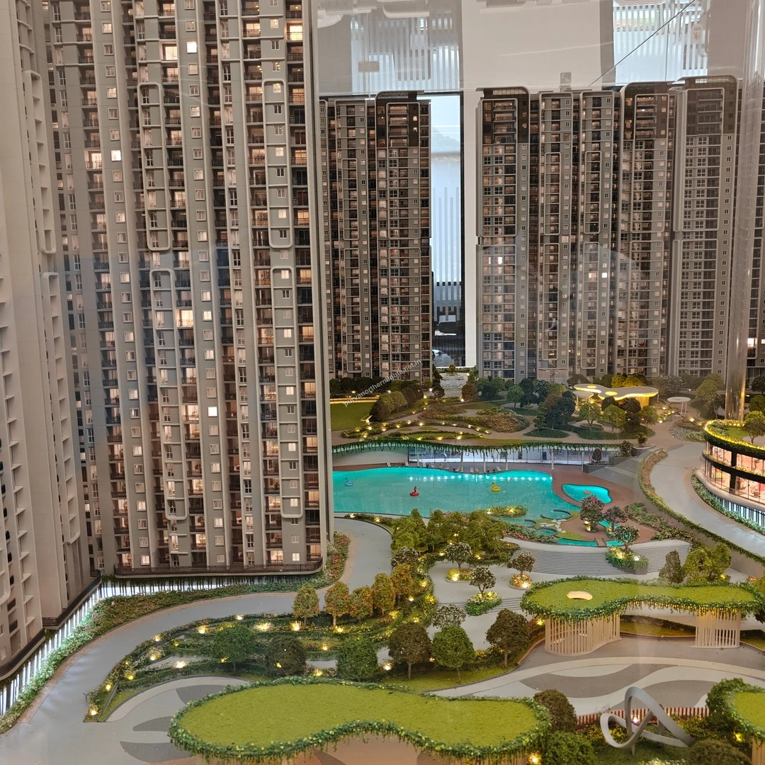 Elevated model perspective looking down at the resort-style swimming pool and surrounding lush landscaping captured on mar 13