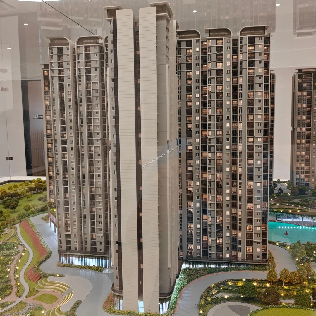 Miniature representation of the high-rise facade with a glimpse of the luxurious swimming pool area in the background taken on mar 13