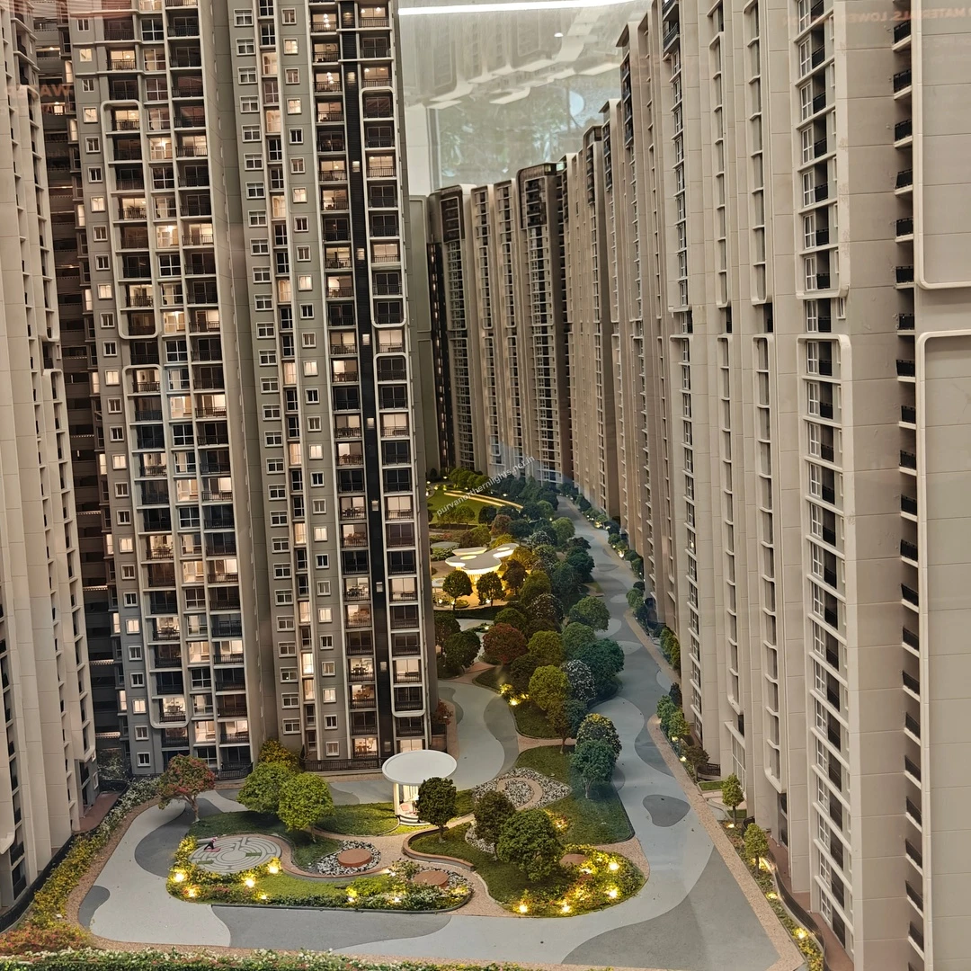 Detailed architectural scale model highlighting the central green spine and dense tree planting at Purva Northern Lights