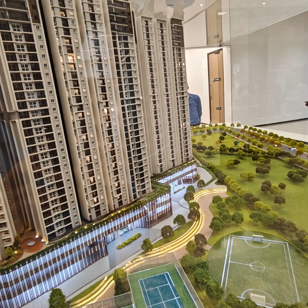 Comprehensive scale model view taken on mar 13 highlighting the outdoor tennis court and adjacent football field amenities near the towers