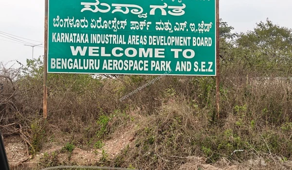 Green KIADB welcome signboard for Bengaluru Aerospace Park and SEZ near Purva Northern Lights