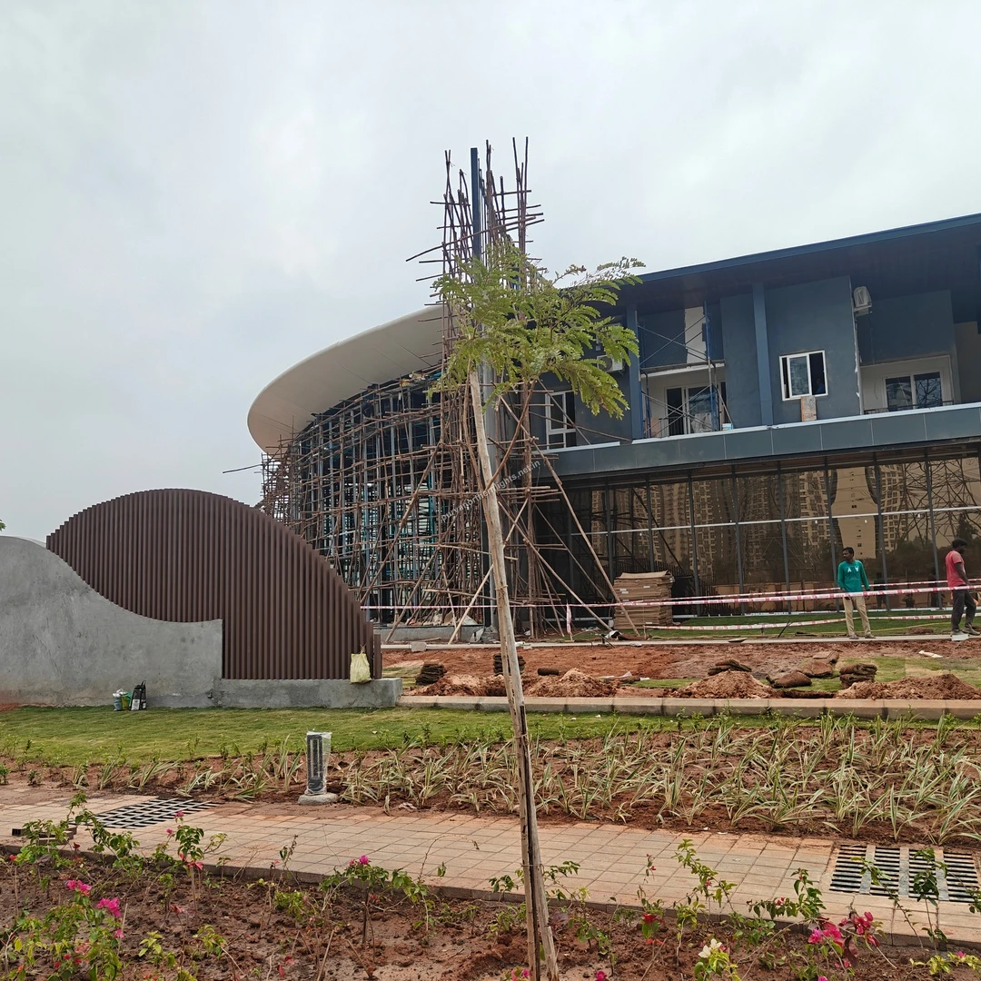 Exterior view of the clubhouse and ongoing permanent site office construction at Purva Northern Lights