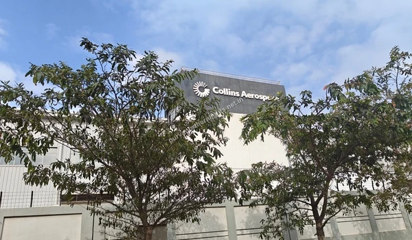 View of the Collins Aerospace corporate building facade and signage situated near the Purva Northern Lights project