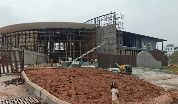 Exterior construction view of the Purva Northern Lights clubhouse showing scaffolding and ongoing site work