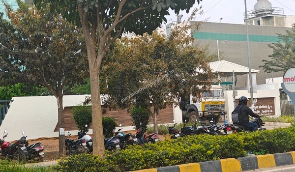 A logistics vehicle entering the Dynatech Tools & Devices facility near Purva Northern Lights, illustrating the active industrial zone in Devanahalli.