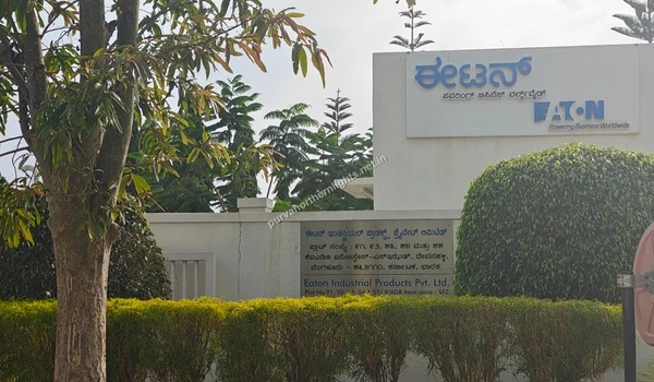 Entrance signage board of Eaton Industrial Products Pvt Ltd featuring English and Kannada text near Purva Northern Lights