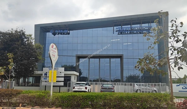 Modern glass facade building of Fuji Silvertech and SMTC India located in the KIADB area near Purva Northern Lights