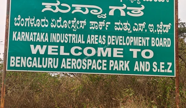 Close-up of green KIADB welcome sign for Bengaluru Aerospace Park and SEZ near Purva Northern Lights