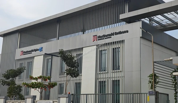 Modern exterior facade of the MacDermid Alpha and MacDermid Enthone Industrial Solutions building near Purva Northern Lights