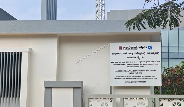 White signage board of MacDermid Alpha Electronics Solutions India Pvt Ltd near Purva Northern Lights