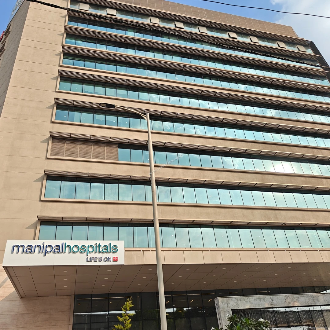 The prominent Manipal Hospitals signage and building exterior, showcasing the reliable emergency and specialty services in the neighborhood.