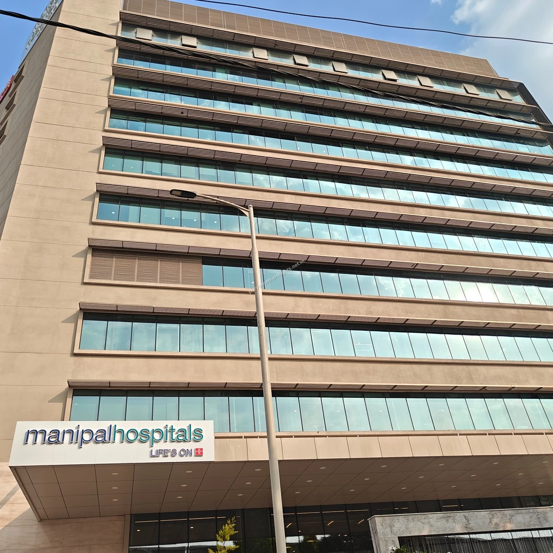 Sunlight reflecting off the Manipal Hospitals building this Mar 13, a beacon of health and wellness situated conveniently close to the project.