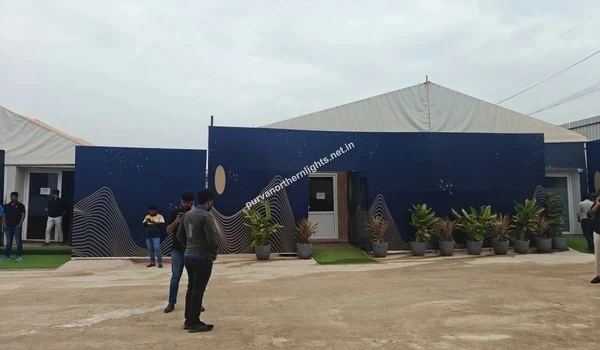 Close-up architectural view of the Purva Northern Lights marketing office entrance displaying the signature blue facade design