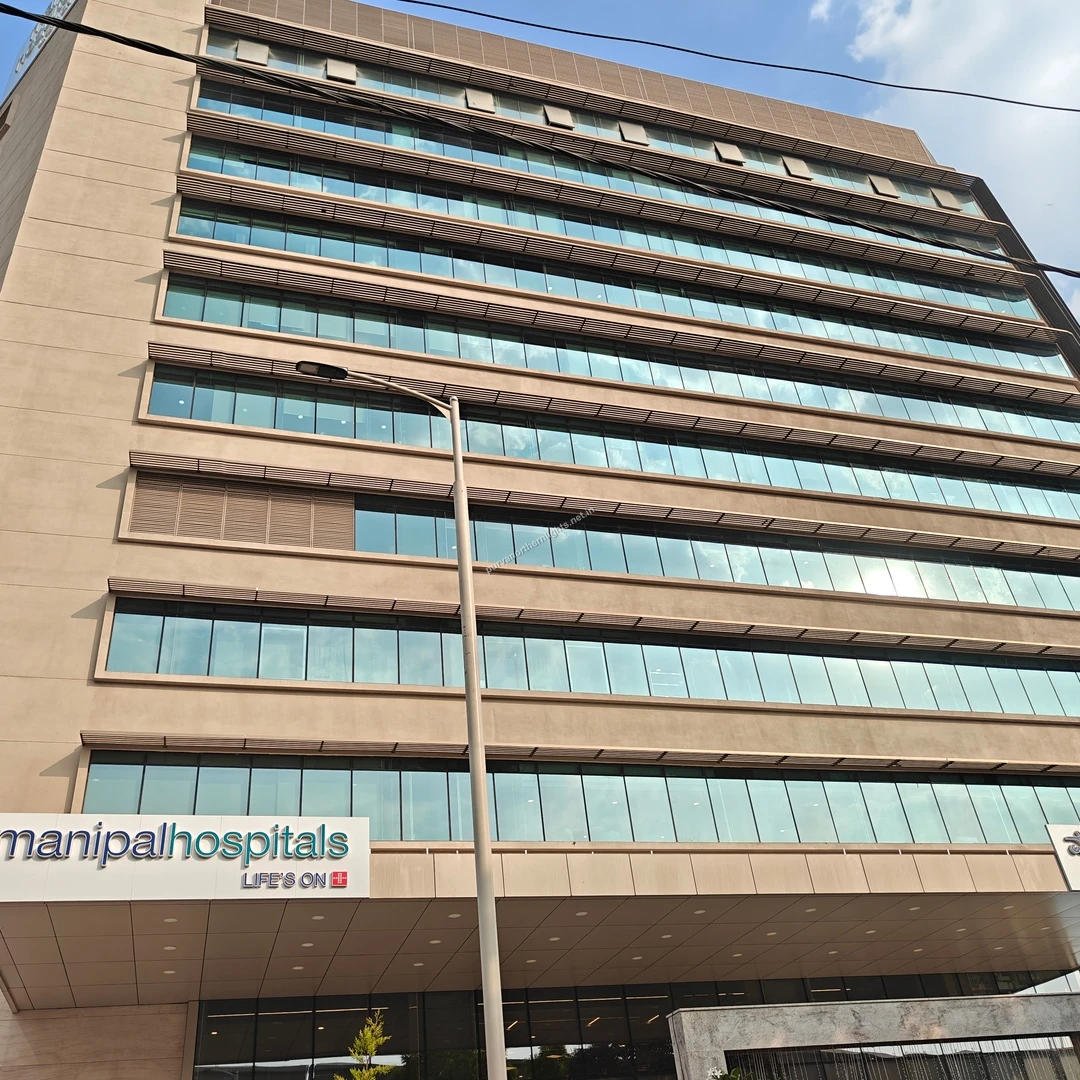 A daytime view of the modern Manipal Hospitals structure, ensuring top-tier medical care for the residents of Purva Northern Lights.