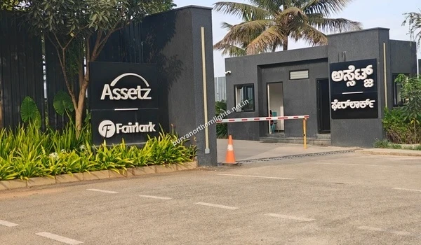 View of the main entrance gate and archway of the Assetz Fairlark premium residential project, located near the Purva Northern Lights development in North Bangalore