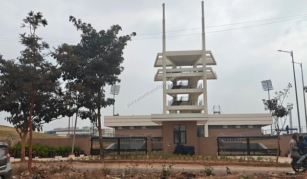 Multi-level concrete observation tower with viewing decks and floodlights at the Centre of Excellence sports facility near Purva Northern Lights