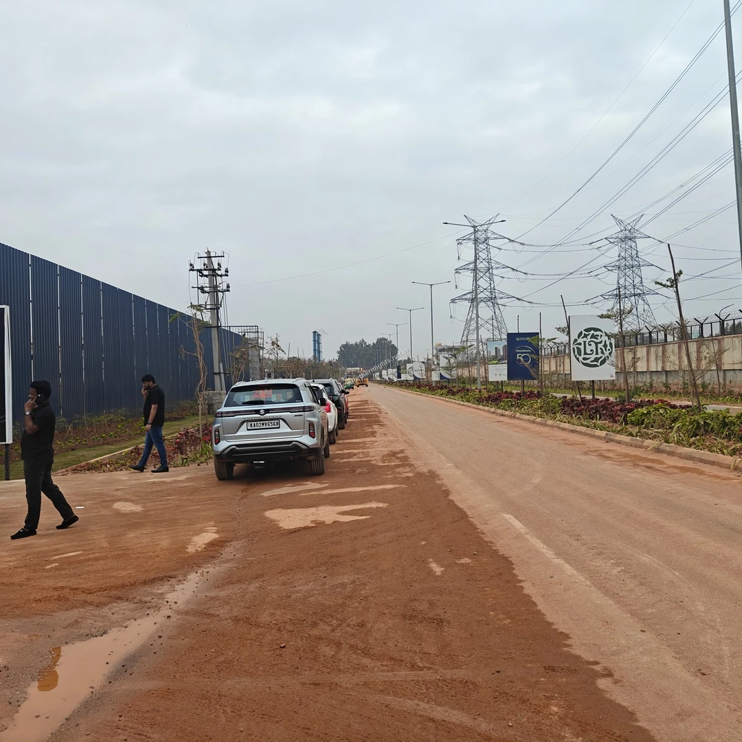 Pathway and approach road leading towards the ongoing permanent site office and marketing area at Purva Northern Lights