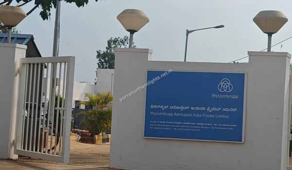 Blue signage board of Thyssenkrupp Aerospace India Private Limited at the entrance near Purva Northern Lights
