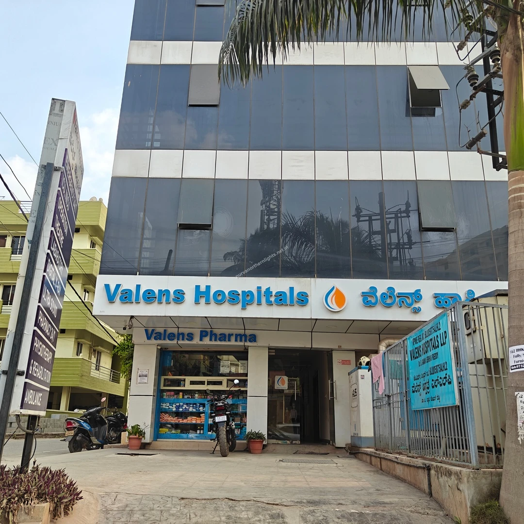Valens Hospitals and Pharma entrance offering 24/7 medical and pharmacy support near the Purva Northern Lights property.