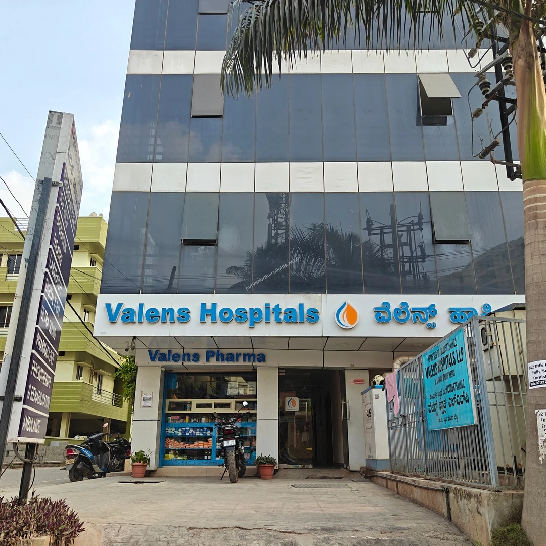 Street level perspective of Valens Hospitals featuring the attached pharmacy block easily reachable from Purva Northern Lights.