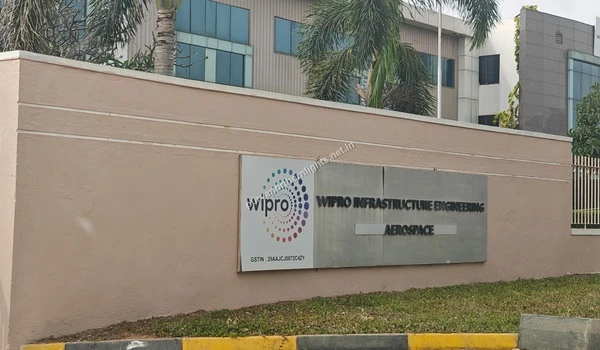 Wipro Infrastructure Engineering Aerospace company signage on a compound wall, located near Purva Northern Lights