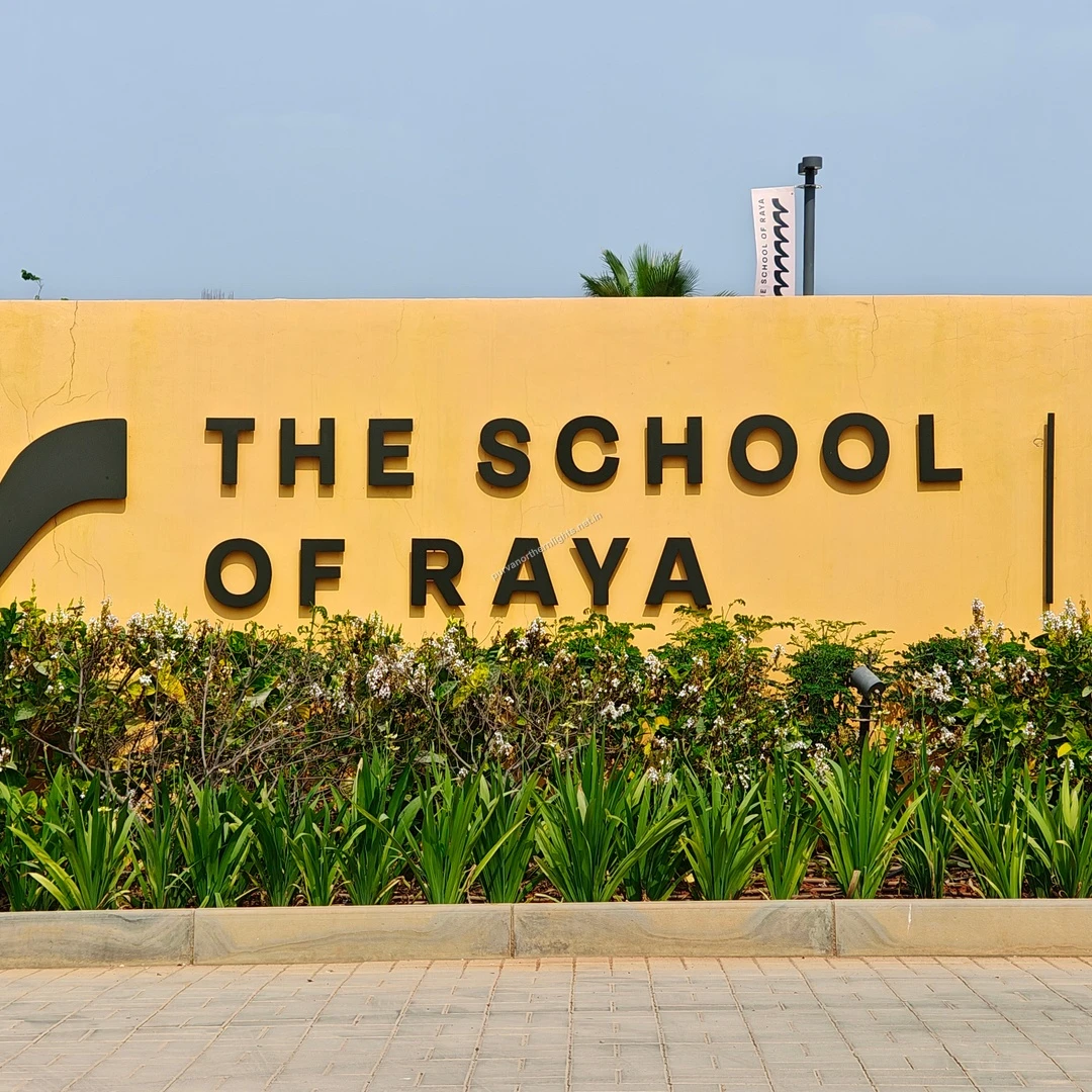 Raya School Sign A wide perspective of The School of Raya campus wall and signage captured during a sunny afternoon walk on Mar 13.