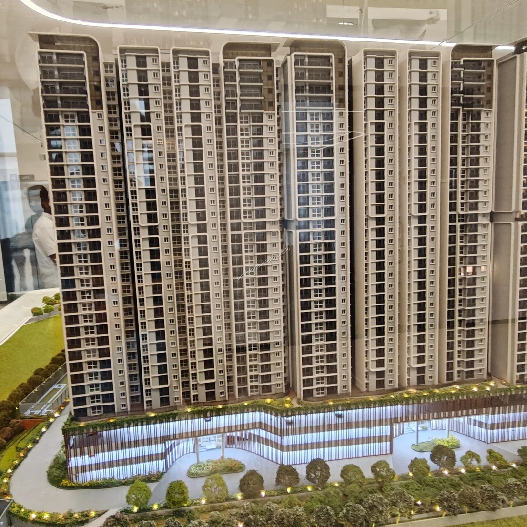 Straight-on miniature model perspective showcasing the highly detailed facade, windows, and balconies of the residential towers updated mar 13