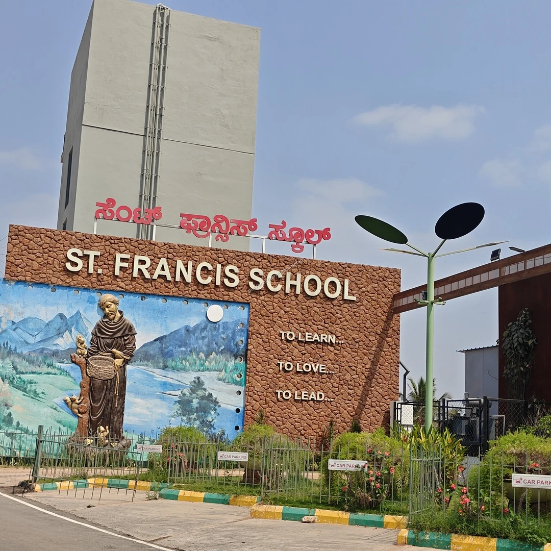 St Francis School A beautiful view of the St. Francis School entrance showing a landscape mural and modern streetlamps near Purva Northern Lights.
