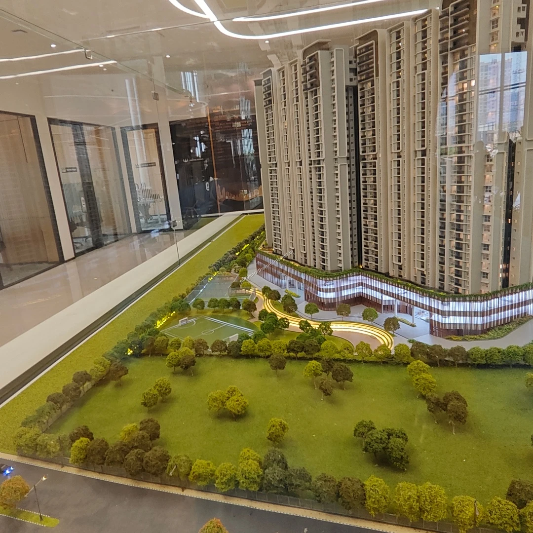 Architectural layout model displaying the sweeping curved driveway and extensive peripheral gardens captured on mar 13 at the project site