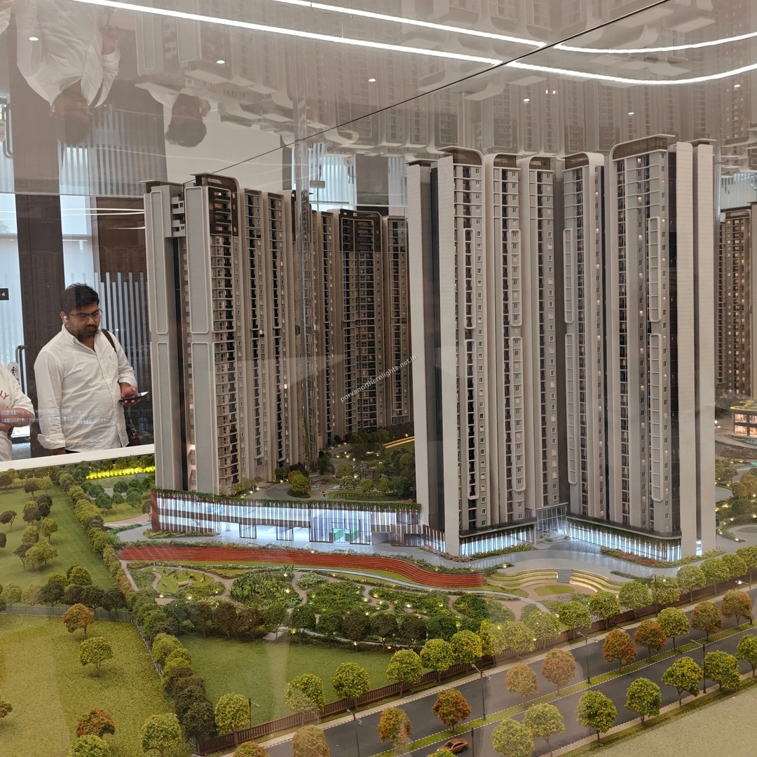Detailed architectural model showing the towering residential blocks and the intricately landscaped terraced base at Purva Northern Lights