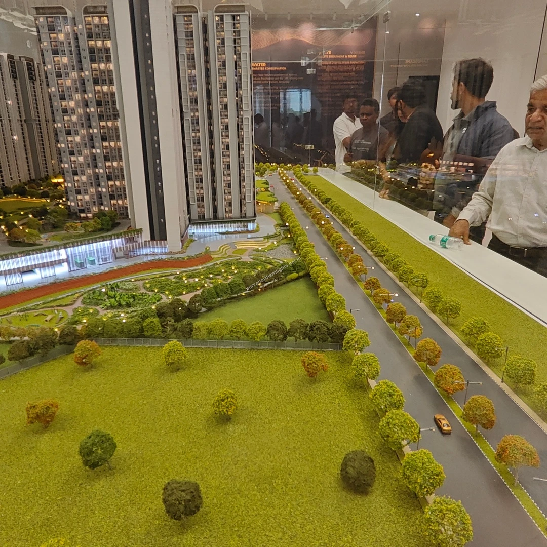 Detailed representation of the tree lined entry road alongside the large foreground meadow in the project master plan model